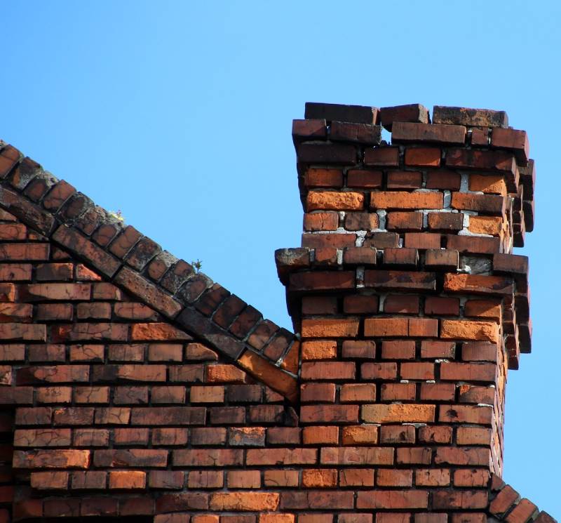 Blog Article - Damaged chimney on an Mt Clemens home showing cracks and missing mortar